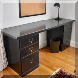 F34. Black painted desk. 18”h x 66”w x 20”d 